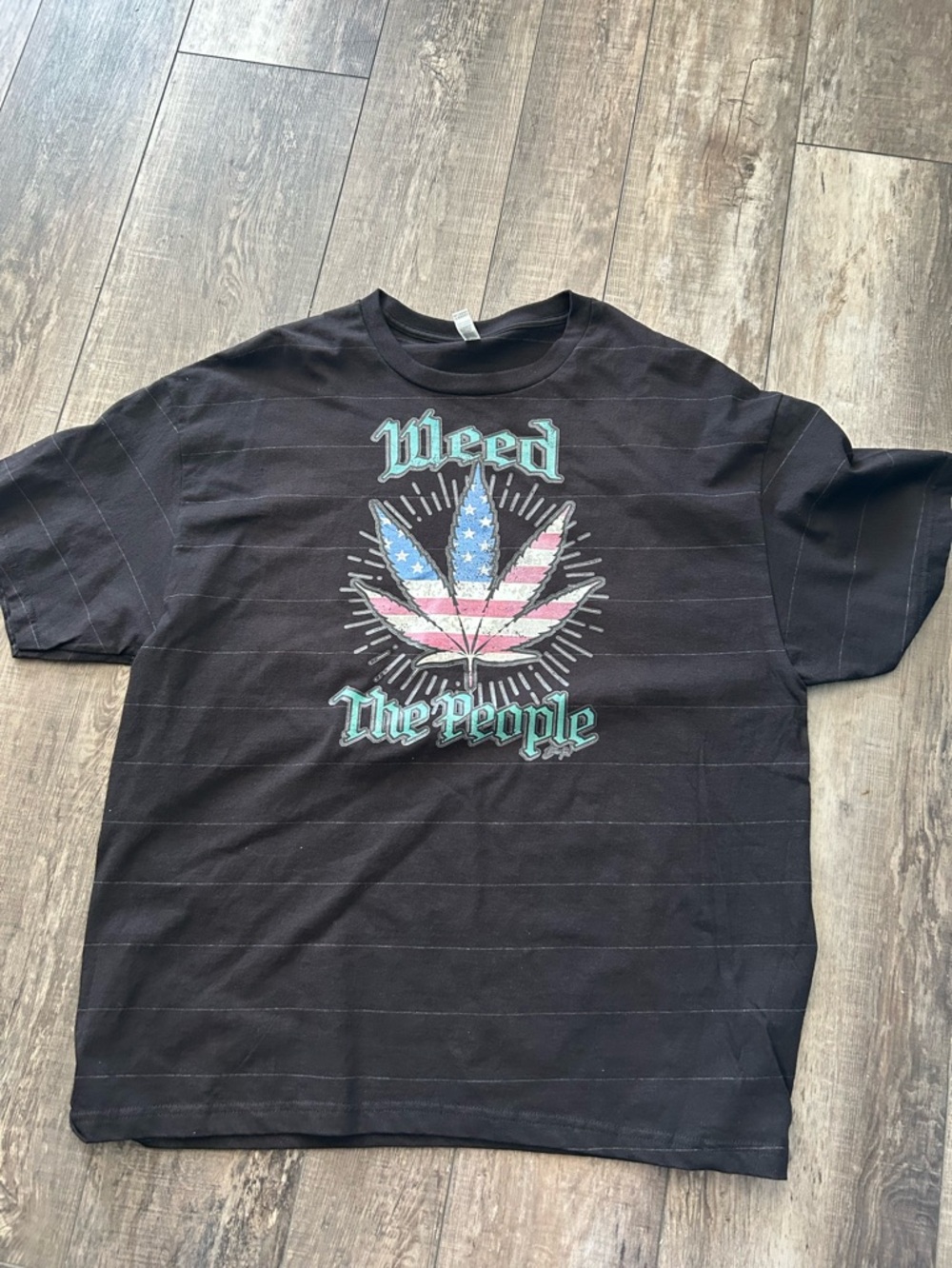 Private Label Black Short-Sleeve Tee with Patriotic Leaf Graphic. Shelf